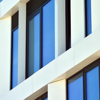 building-with-lot-windows-that-say-s-it 1